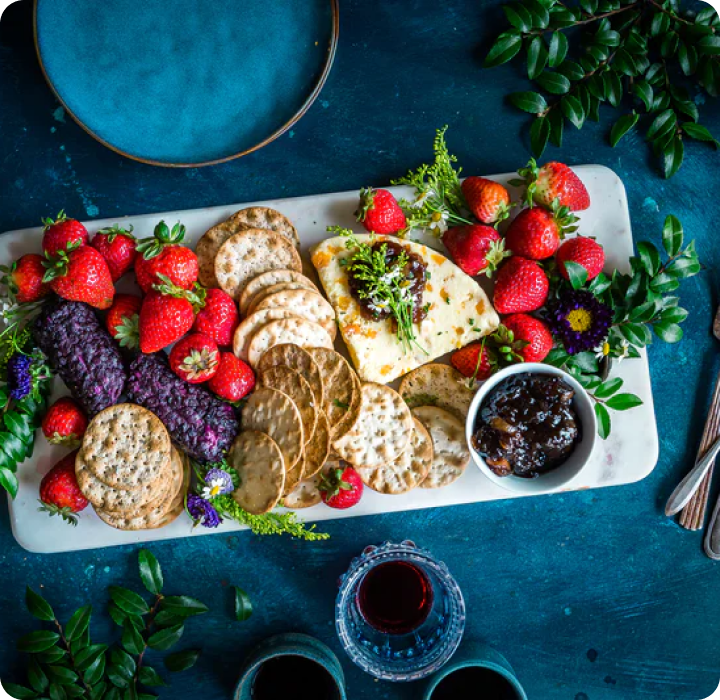 Photo of salty crackers with fruits and sauces